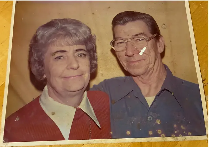 Creases and tears on a 1950s-1970s photograph, before hand restoration by MemoryCherish artists