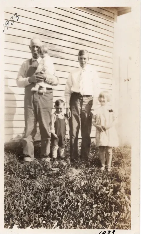 Discoloration on a pre-1950 photograph, before hand restoration by MemoryCherish artists