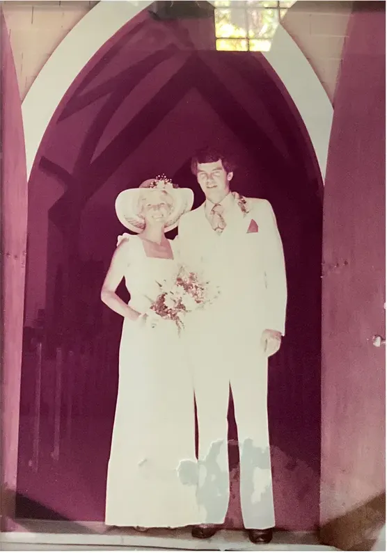 Water damage on a 1950s-1970s photograph, before hand restoration by MemoryCherish artists