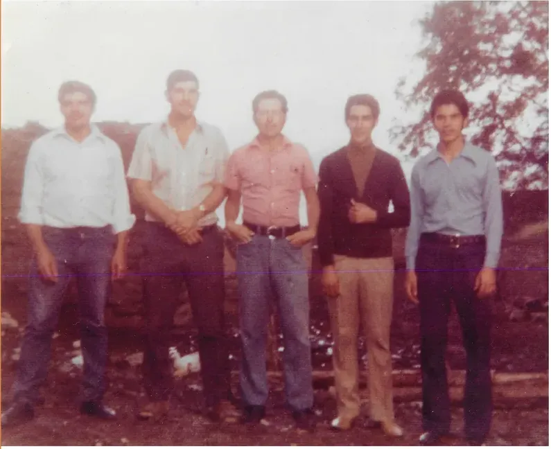 Creases and tears on a 1950s-1970s photograph, before hand restoration by MemoryCherish artists