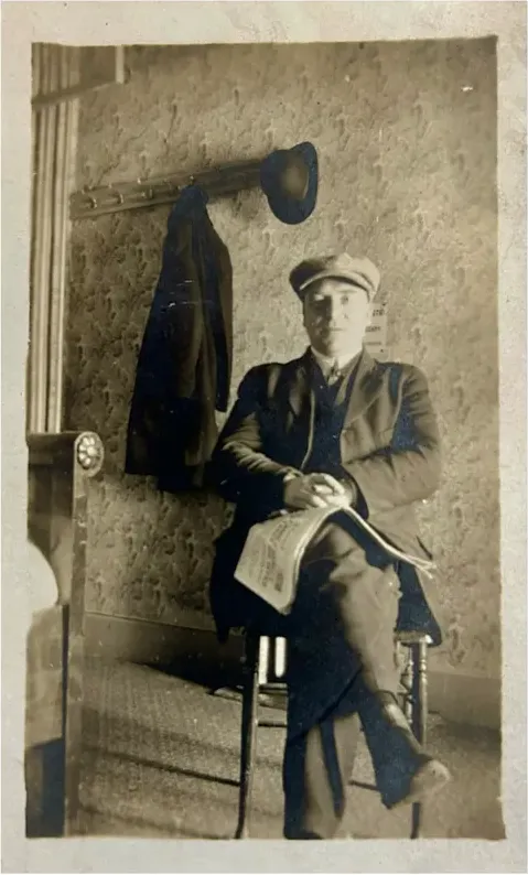 Discoloration on a pre-1950 photograph, before hand restoration by MemoryCherish artists