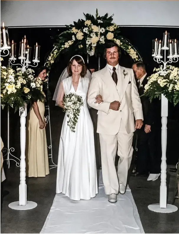 The same 1950s-1970s photograph after hand restoration by MemoryCherish, discoloration repaired and detail recovered