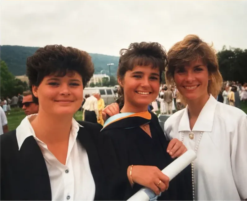 The same 1980s-plus photo restored by hand at MemoryCherish, creases and tears corrected and clarity brought back