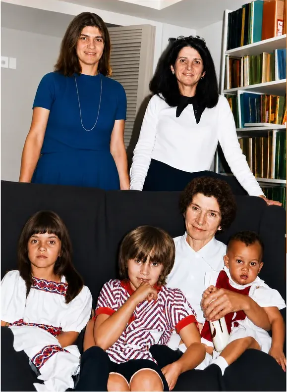 The same 1950s-1970s photograph after hand restoration by MemoryCherish, discoloration repaired and detail recovered