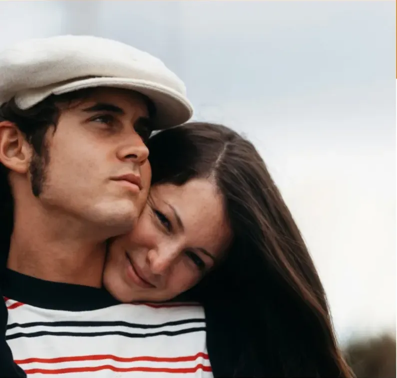 The same 1950s-1970s photograph after hand restoration by MemoryCherish, creases and tears repaired and detail recovered