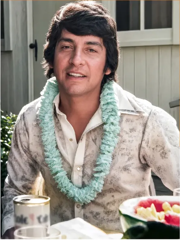 The same 1950s-1970s photograph after hand restoration by MemoryCherish, discoloration repaired and detail recovered
