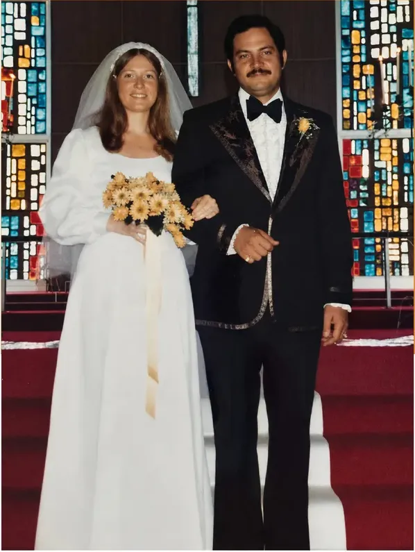The same 1950s-1970s photograph after hand restoration by MemoryCherish, fading repaired and detail recovered