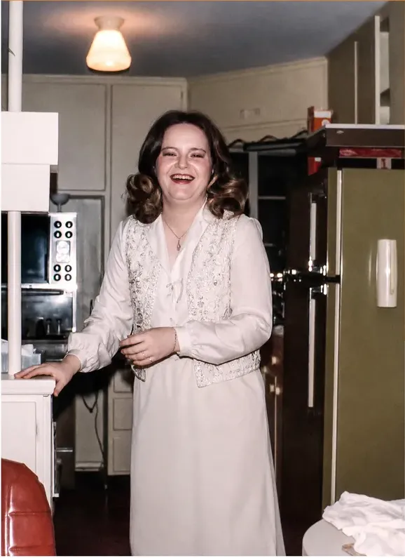 The same 1950s-1970s photograph after hand restoration by MemoryCherish, discoloration repaired and detail recovered