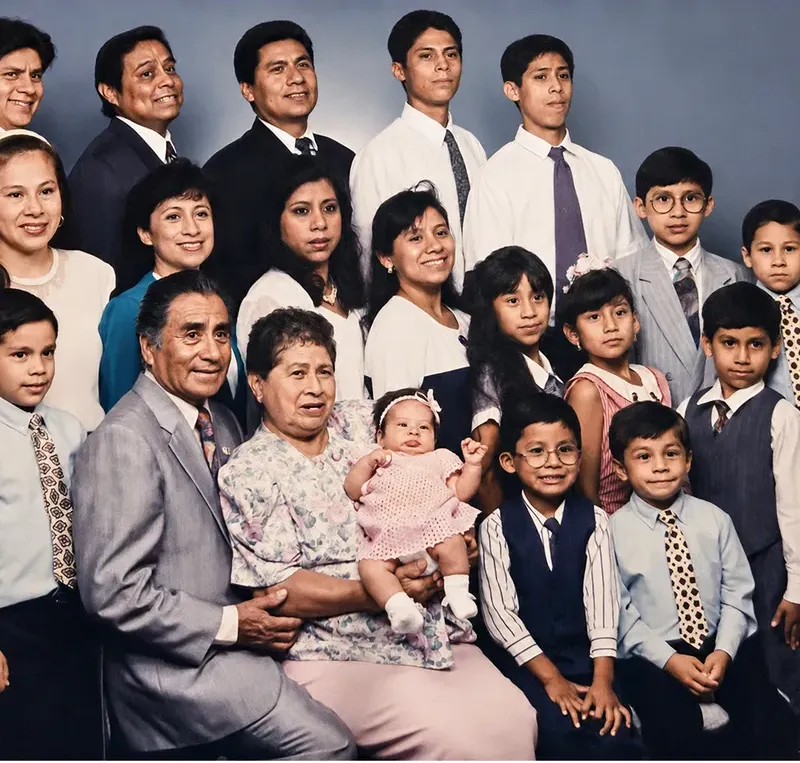 The same 1980s-plus photo restored by hand at MemoryCherish, fading corrected and clarity brought back
