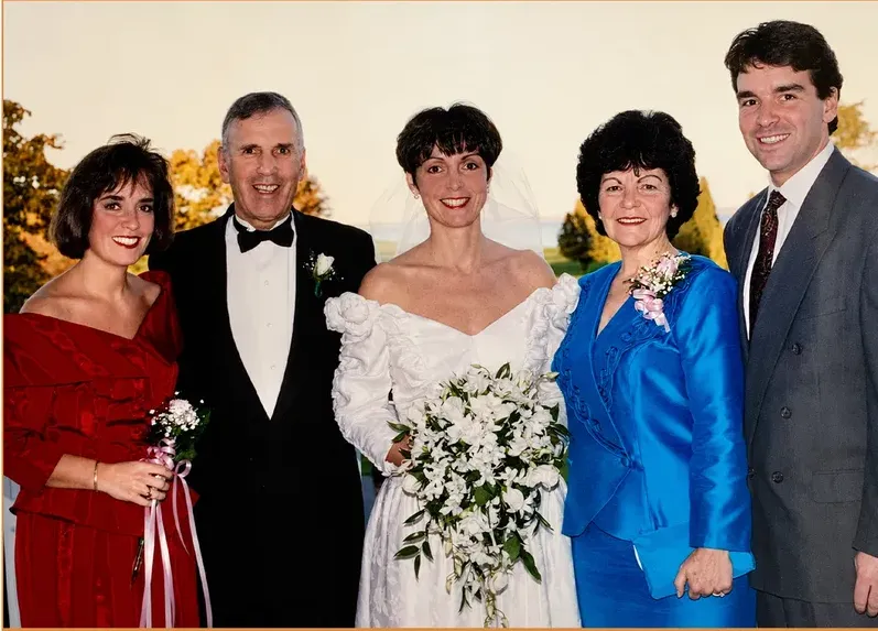The same 1980s-plus photograph after hand restoration by MemoryCherish, discoloration repaired and detail recovered
