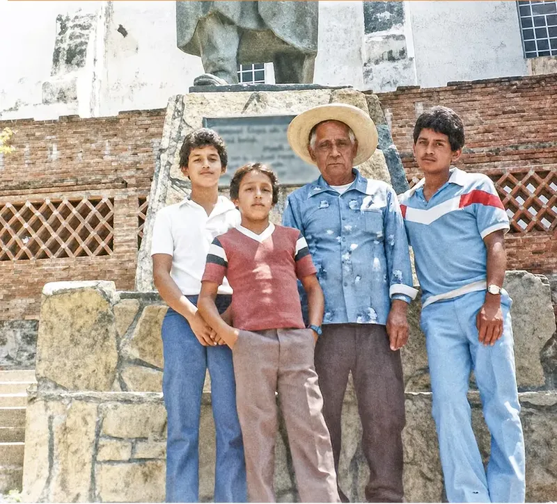 The same 1980s-plus photograph after hand restoration by MemoryCherish, discoloration repaired and detail recovered