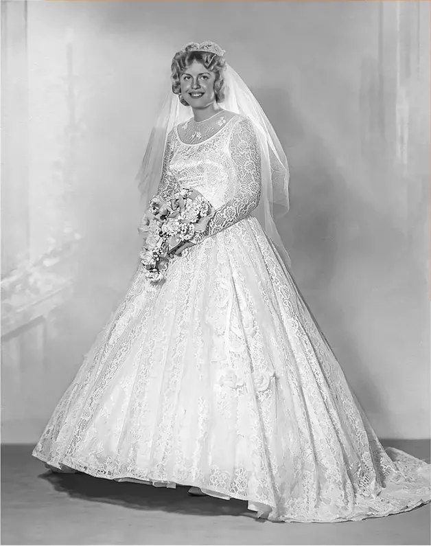 The same 1950s-1970s photo restored by hand at MemoryCherish, water damage corrected and clarity brought back