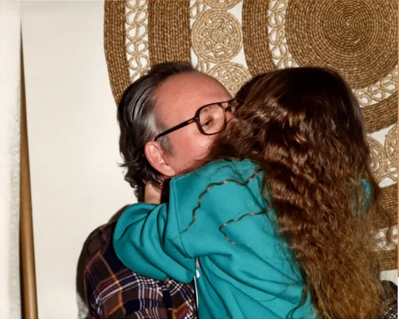 The same 1980s-plus photo restored by hand at MemoryCherish, water damage corrected and clarity brought back