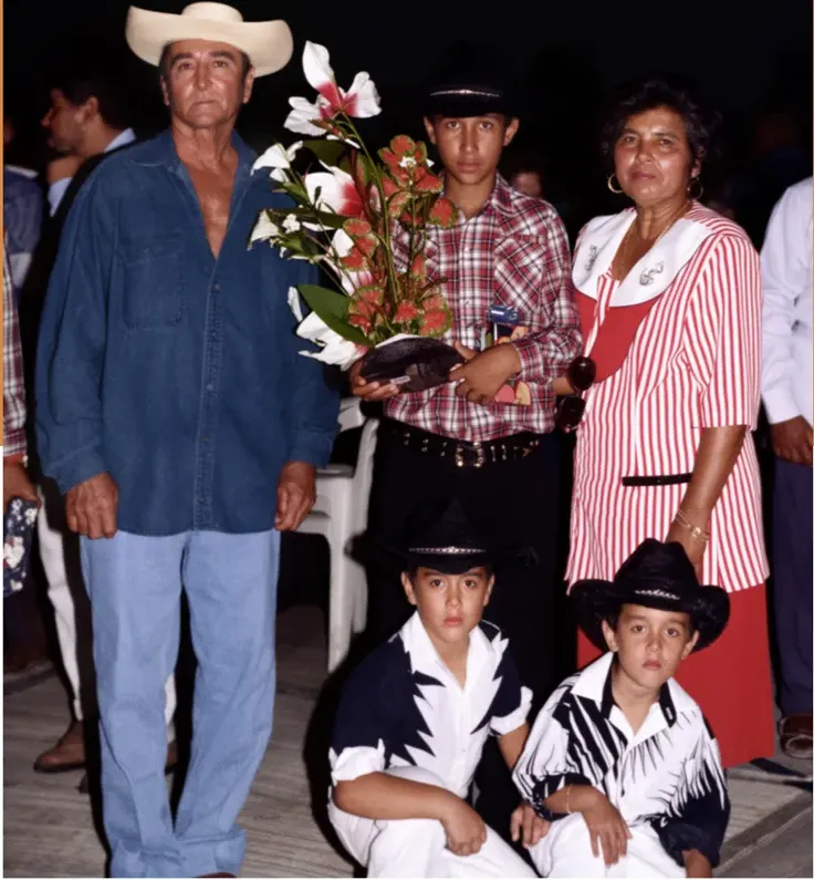 The same 1980s-plus photo restored by hand at MemoryCherish, water damage corrected and clarity brought back