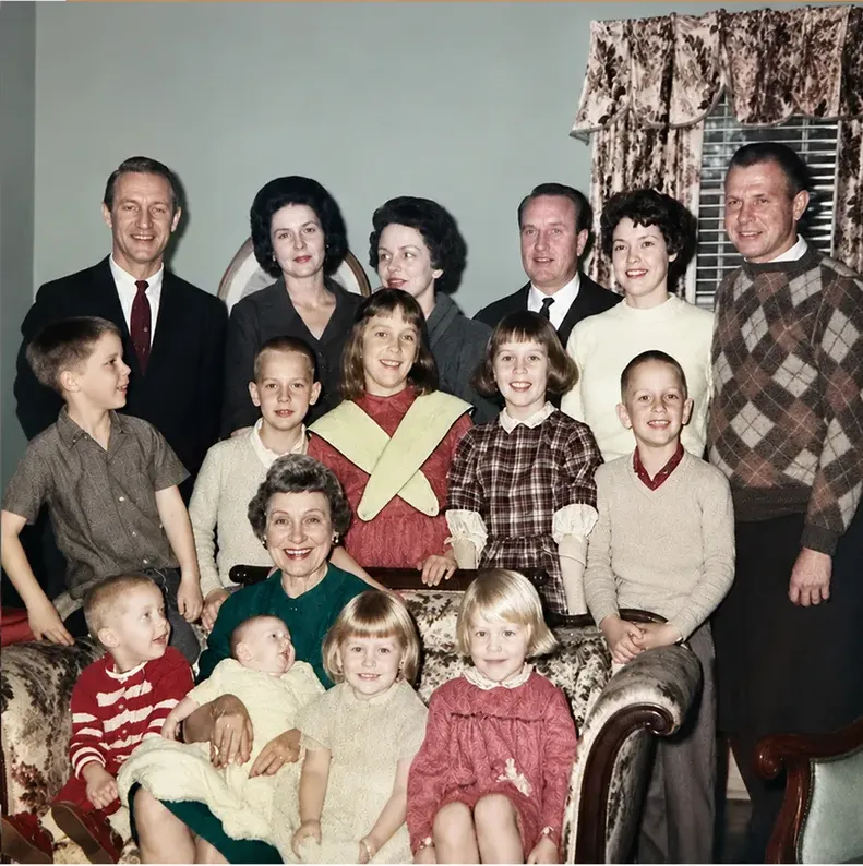 The same 1950s-1970s photograph after hand restoration by MemoryCherish, creases and tears repaired and detail recovered