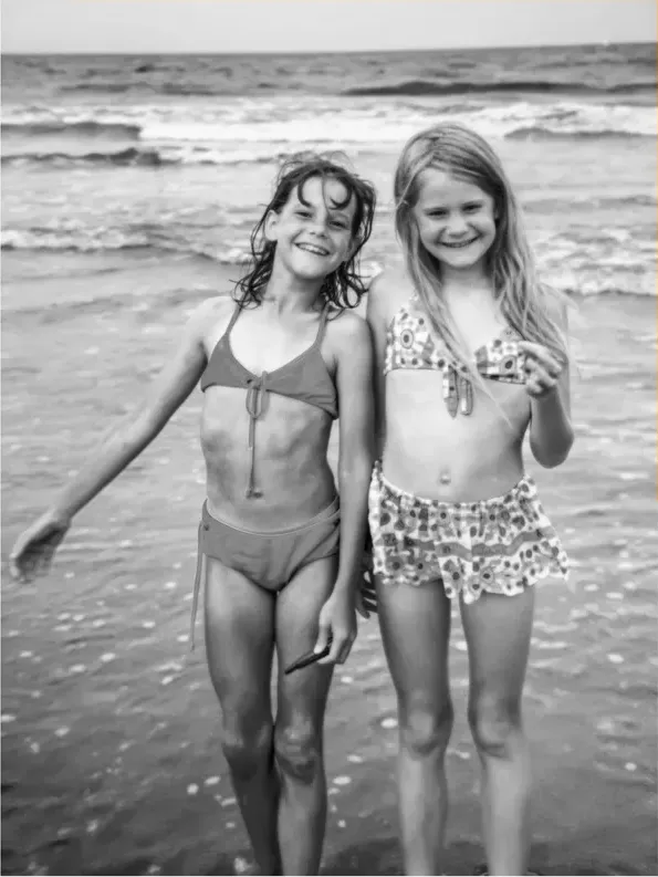The same 1950s-1970s photo restored by hand at MemoryCherish, fading corrected and clarity brought back