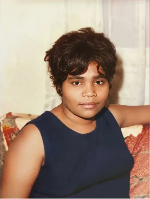 The same 1950s-1970s photo restored by hand at MemoryCherish, creases and tears corrected and clarity brought back
