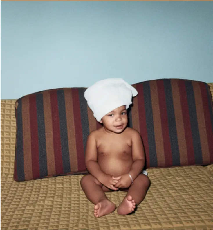 The same 1950s-1970s photo restored by hand at MemoryCherish, creases and tears corrected and clarity brought back