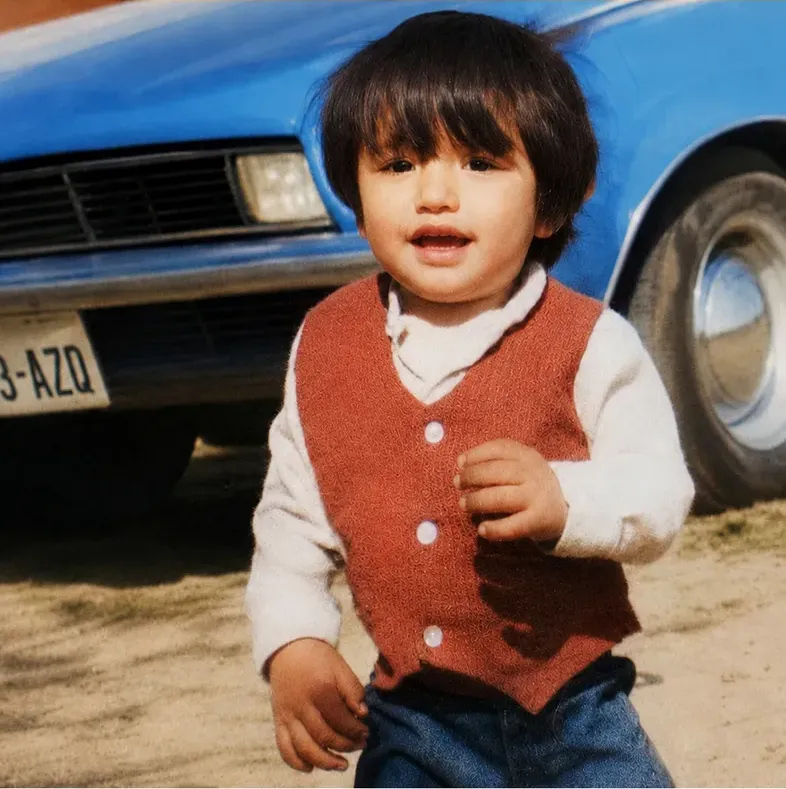The same 1980s-plus photo restored by hand at MemoryCherish, creases and tears corrected and clarity brought back