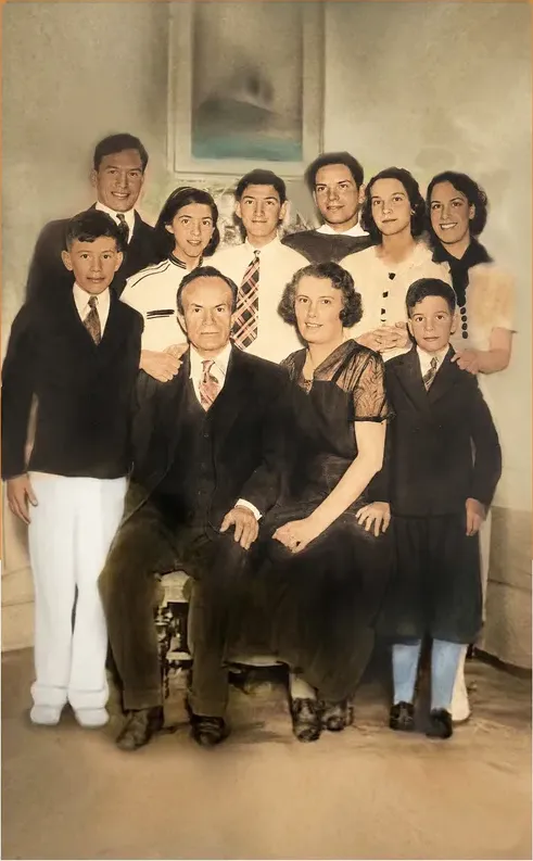 The same pre-1950 photograph after hand restoration by MemoryCherish, water damage repaired and detail recovered