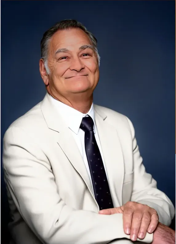 The same 1980s-plus photo restored by hand at MemoryCherish, water damage corrected and clarity brought back
