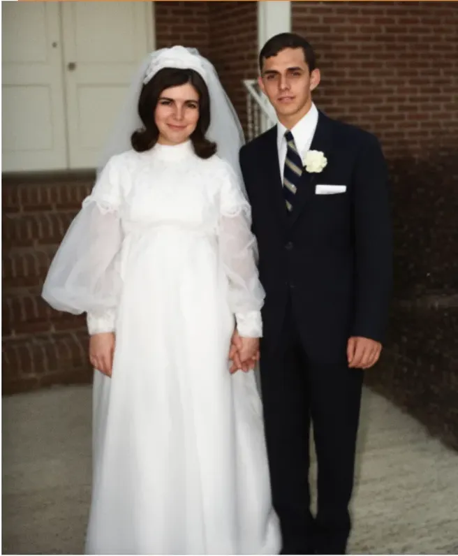 The same 1950s-1970s photograph after hand restoration by MemoryCherish, stains and marks repaired and detail recovered
