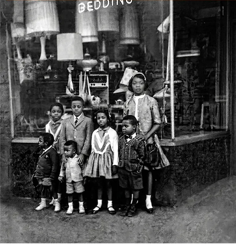 The same 1950s-1970s photo restored by hand at MemoryCherish, creases and tears corrected and clarity brought back
