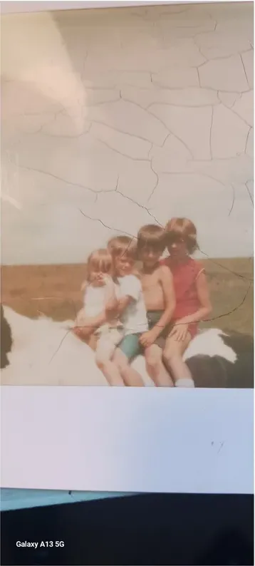 Creases and tears on a 1950s-1970s photograph, before hand restoration by MemoryCherish artists