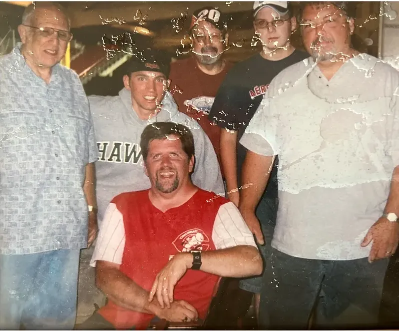 Water damage on a 1980s-plus photograph, before hand restoration by MemoryCherish artists
