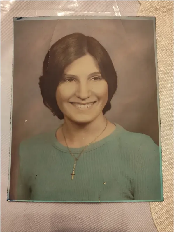 Creases and tears on a 1950s-1970s photograph, before hand restoration by MemoryCherish artists