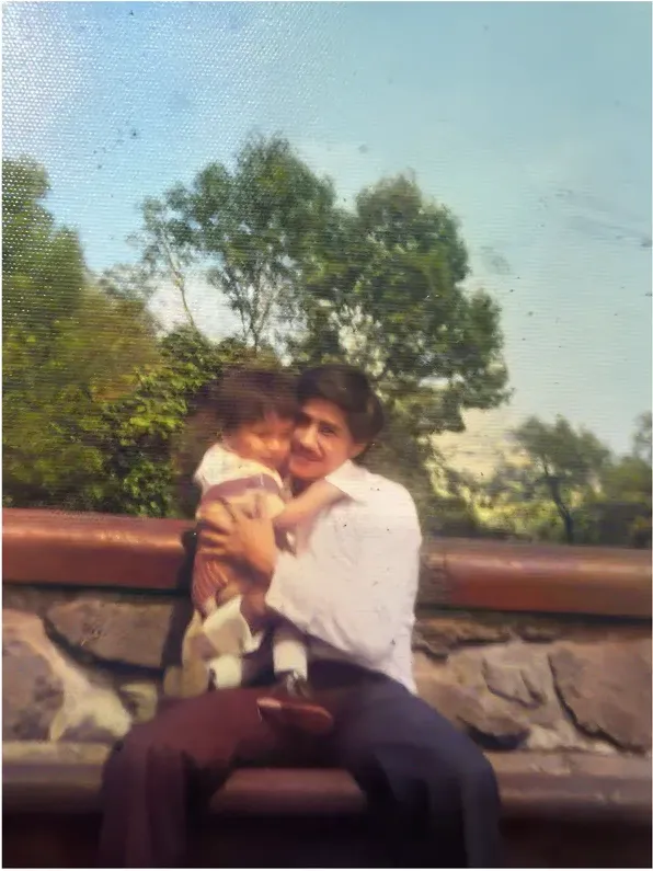 Stains and marks on a 1980s-plus photograph, before hand restoration by MemoryCherish artists