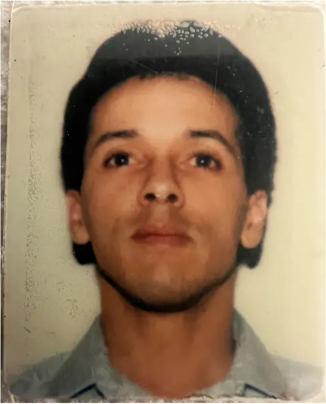 Water damage on a 1980s-plus photograph, before hand restoration by MemoryCherish artists