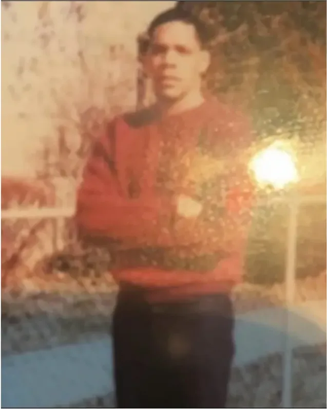 Water damage on a 1980s-plus photograph, before hand restoration by MemoryCherish artists