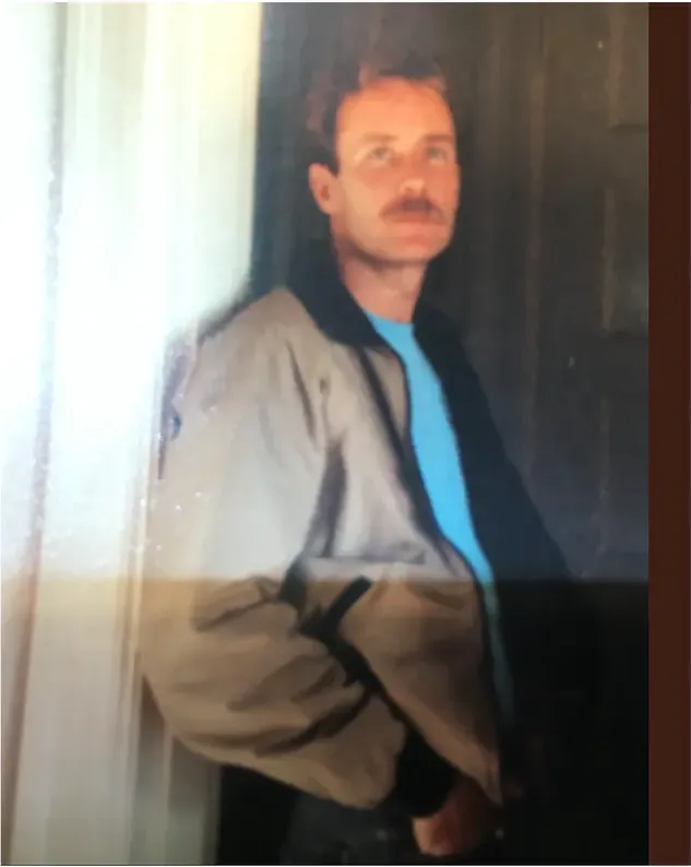 Water damage on a 1980s-plus photograph, before hand restoration by MemoryCherish artists