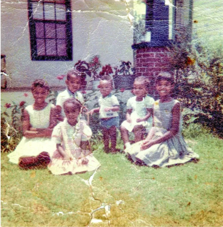 Creases and tears on a 1950s-1970s photograph, before hand restoration by MemoryCherish artists