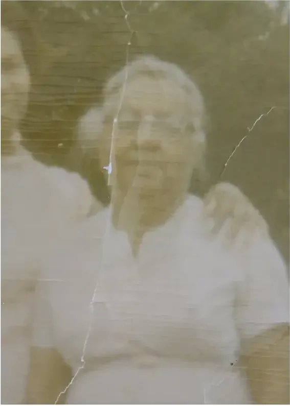 Creases and tears on a photograph, before hand restoration by MemoryCherish artists