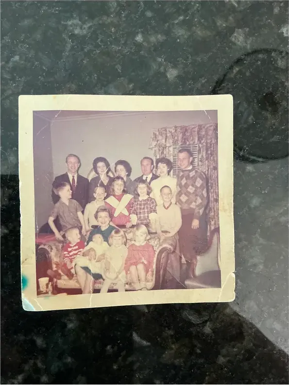 Creases and tears on a 1950s-1970s photograph, before hand restoration by MemoryCherish artists