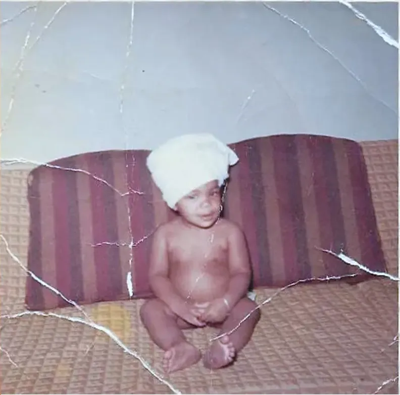 Original 1950s-1970s photograph showing creases and tears, before photo restoration by MemoryCherish
