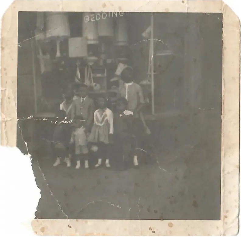 Original 1950s-1970s photograph showing creases and tears, before photo restoration by MemoryCherish