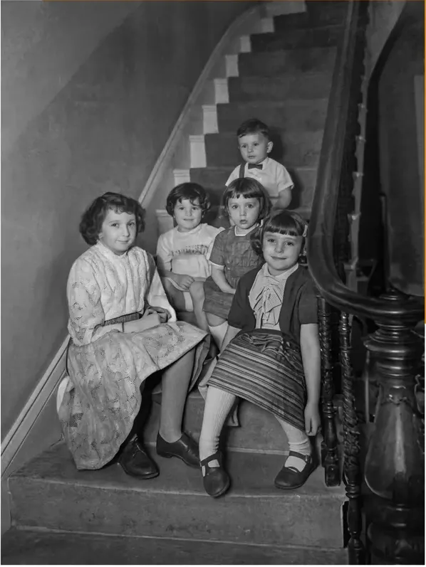 The same 1950s-1970s photograph after hand restoration by MemoryCherish, water damage repaired and detail recovered