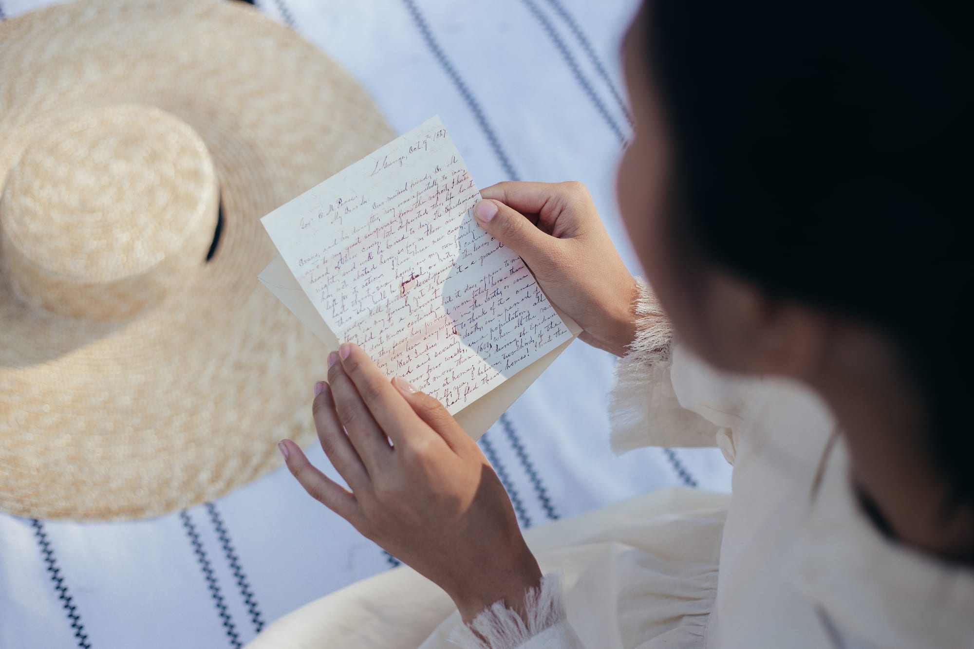 Free Overhead View of Woman Reading Letter Stock Photo