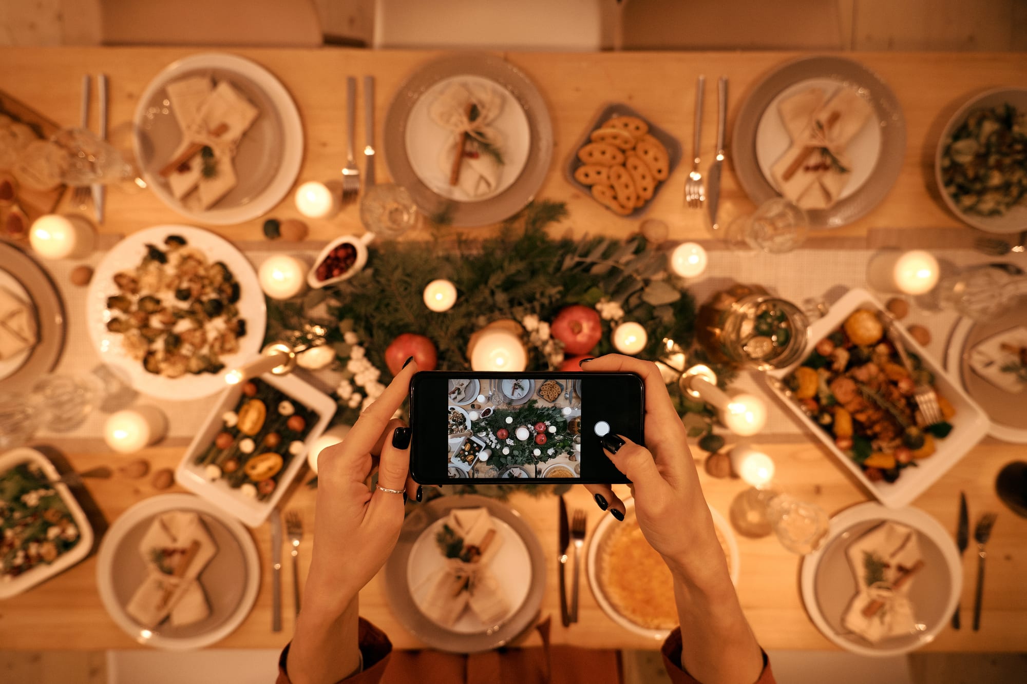Free Top View of a Person Taking Picture of Christmas Dinner Stock Photo