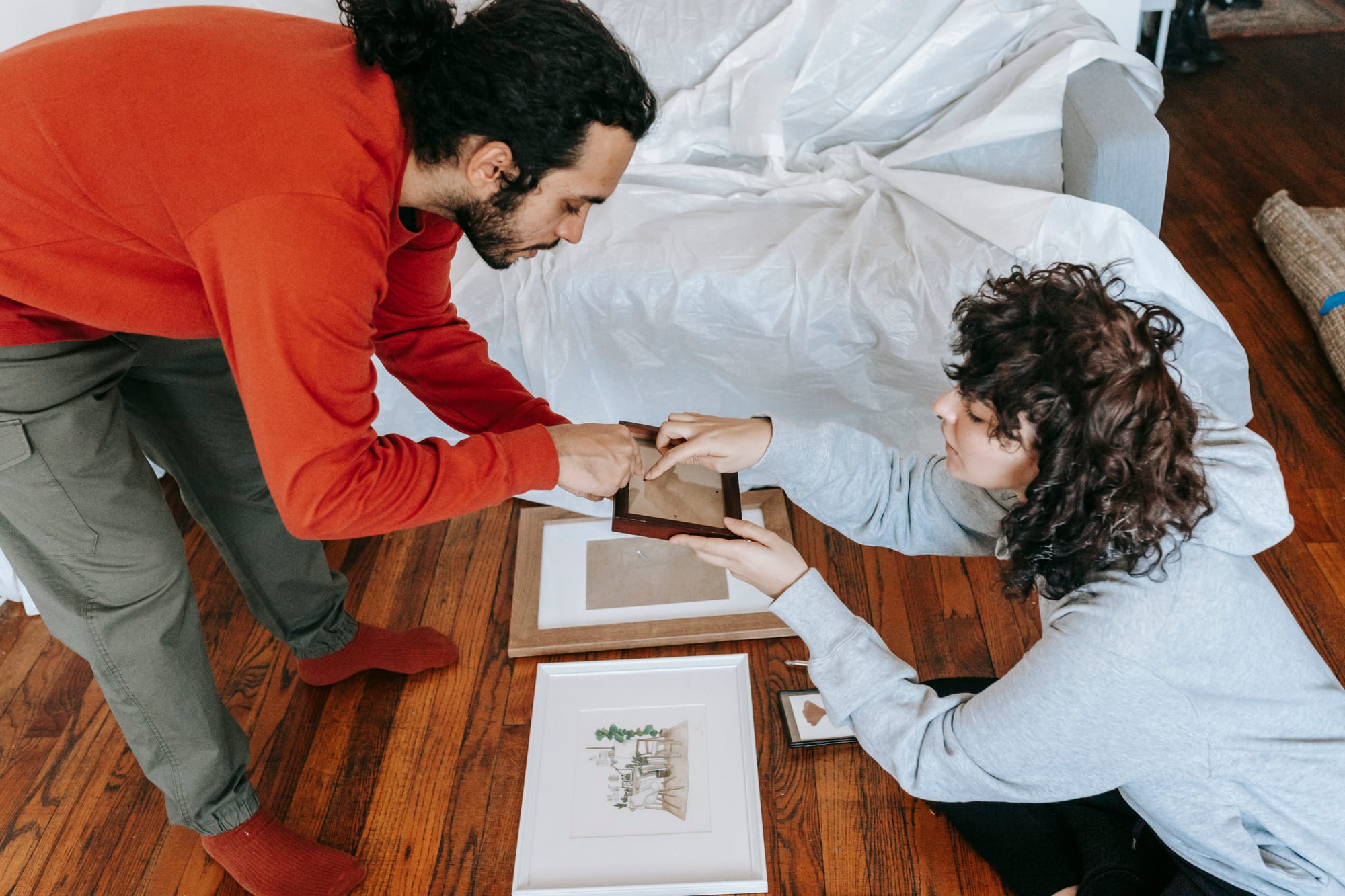 Free Couple Holding A Picture Frame Stock Photo
