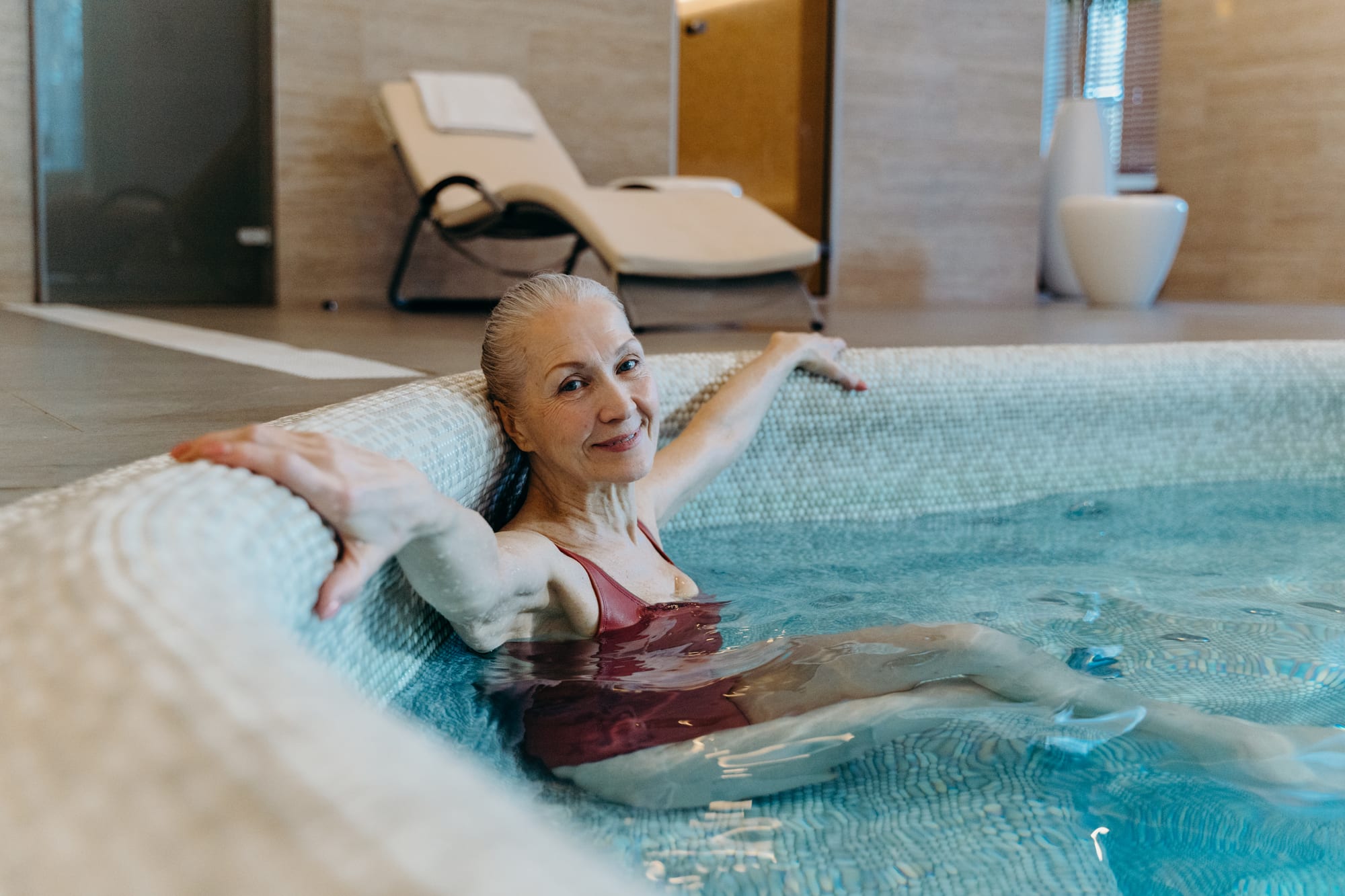Free Elderly Woman Sitting in the Pool Stock Photo